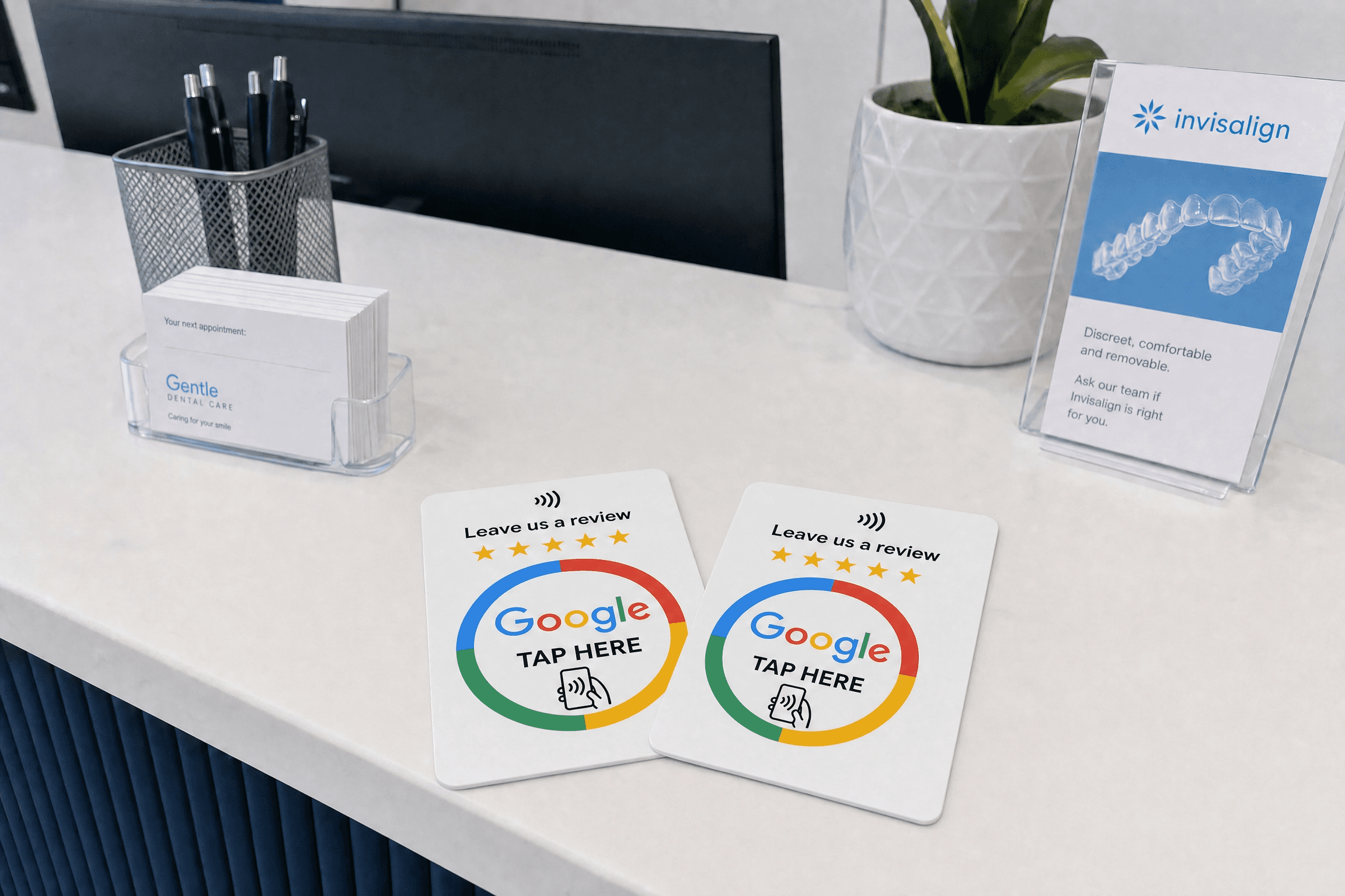 RevuBoost Google review cards on a reception desk