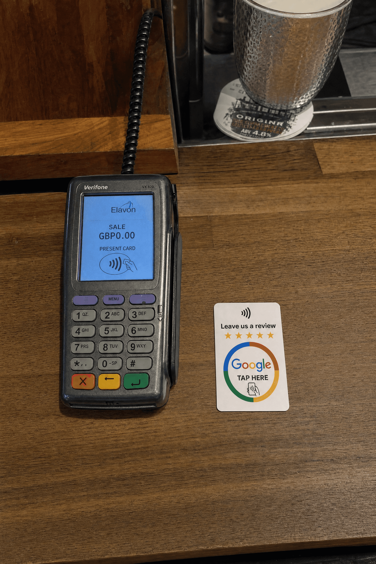 RevuBoost Google review card by the till on a pub bar
